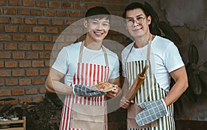 Portrait of two asian handsome men cooking together in kitchen room at home. Lifestyle, Friendship and LBGT Concept