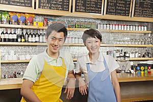 Portrait of two baristas at a coffee shop, Beijing