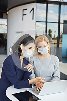 Portrait of Two Businesswomen Wearing Masks in Meeting