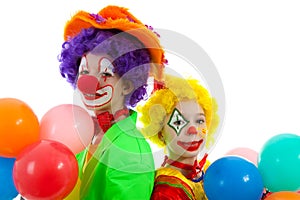 Portrait of two children dressed as clowns