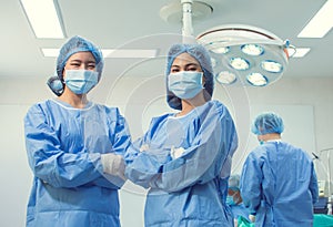 Portrait of two female doctors in operation uniform