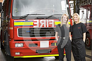 Portrait of two female firefighters standing
