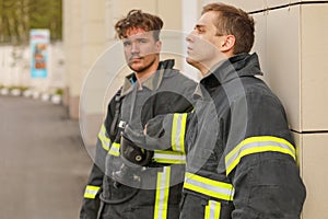 portrait of two firemen without helmets in photo