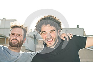 Portrait of two friends smiling and expressing happiness