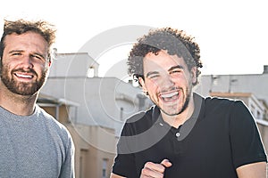 Portrait of two friends smiling and expressing happiness