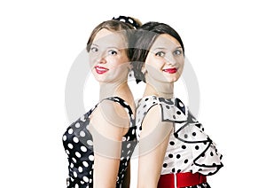 Portrait of two girlfriends in pin-up style