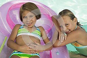 Portrait Of Two Girls In Swimming Pool