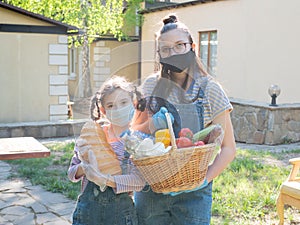 Portrait two girls of the teenager with food packages for the needy during a pandemic coronavirus.