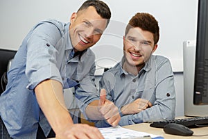 Portrait two happy professional in workshop