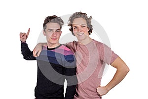Portrait of a two happy young men pointing fingers isolated over white background