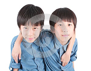 Portrait of two hugging boys, twins