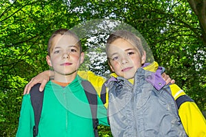 Portrait of two hugging tweens