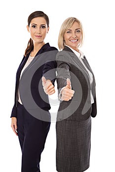 Portrait: Two isolated successful happy business woman making th