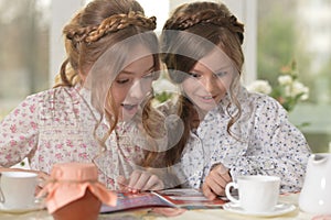 Girls reading magazine