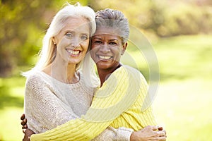 Portrait Of Two Mature Female Friends Hugging