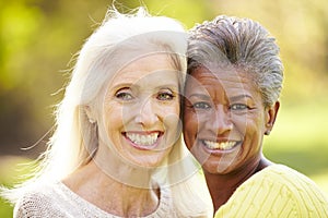 Portrait Of Two Mature Female Friends Hugging