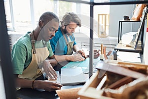 People Working in Artisan Leather Manufactory photo