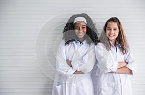 Portrait of two multiracial girl friends with different types of skin