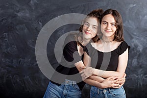 Portrait of two natural  smiling teenage girls. Close up lifestyle portrait of two young girls best friends