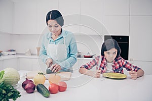 Portrait of two nice cute lovely attractive irritated annoyed bored tired evil girl demanding meal dish mature sweet mom