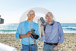 Portrait of two photographers on seaside