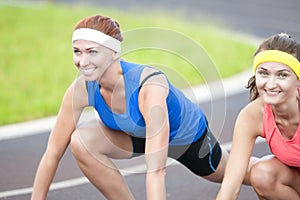 Portrait of Two Pretty Caucasian Sportswomen Having Fun Time