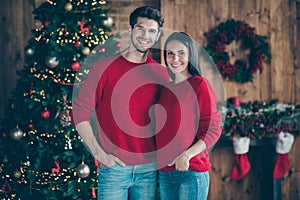 Portrait of two romantic people man and girl enjoy christmas vacation x-mas holidays standing near fir evergreen tree