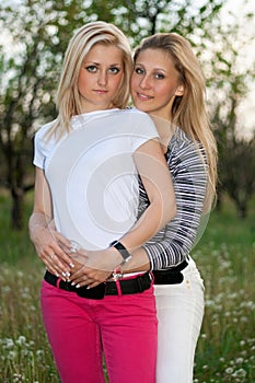 Portrait of two smiling lovely young women