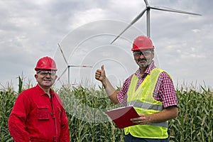 Portrait of Two Smiling Workers at Wind Farm