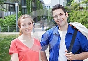 Portrait of two students on campus