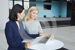 Portrait of Two Successful Businesswomen in Meeting