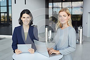 Portrait of Two Successful Businesswomen Smiling in Meeting