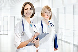 Portrait of two successful female doctors