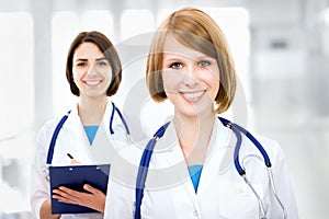 Portrait of two successful female doctors