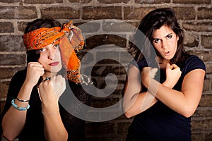 Portrait two tough women orange scarf BFF friends