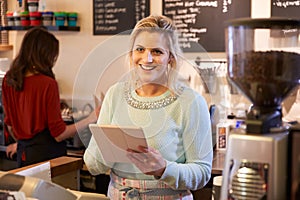 Portrait Of Two Women Running Coffee Shop Together