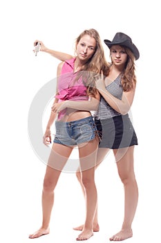 Portrait of two young girls with a gun