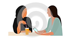 Portrait of two young women talking sitting at table. The concept of friendship or business between people of different