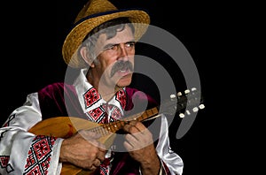 Portrait of Ukrainian farmer playing mandolin