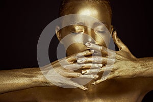 Portrait unearthly Golden girls, hands near the face. Very delicate and feminine. The eyes are closed. Frame of hands