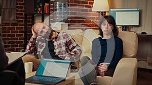 Portrait of unhappy couple attending counseling therapy session