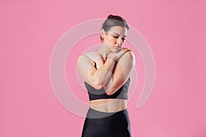 Portrait of unhappy upset woman frowns her face, about to cry, being unhappy as she cannot achieve goals, isolated on pink studio