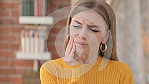 Portrait of Unhealthy Young Woman having Toothache