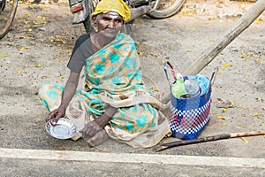 Portrait of an unidentified homeless woman in the street of the sacred city of Rameshwaram, India.