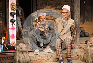 Portrait of unidentified Nepalese man smokes on the street, in Bhaktapur, Nepal.