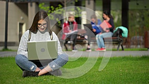 Portrait of university college teenager student studying working using laptop computer