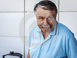 Portrait of an unshaven old man in thought