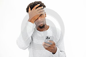 Portrait of upset African American man making face palm