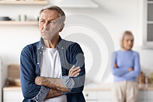 Portrait of upset mature man, having quarrel with his wife