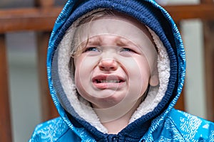 Portrait of an upset two year old boy